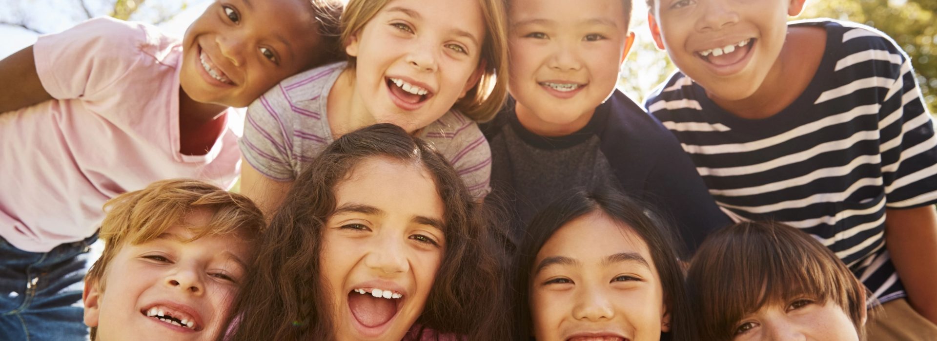 children smiling at the camera