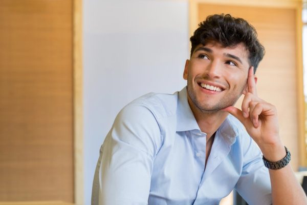 High School boy thinking and smiling about his future