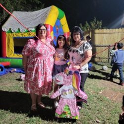 Ximena with school staff and her Lucky pinata